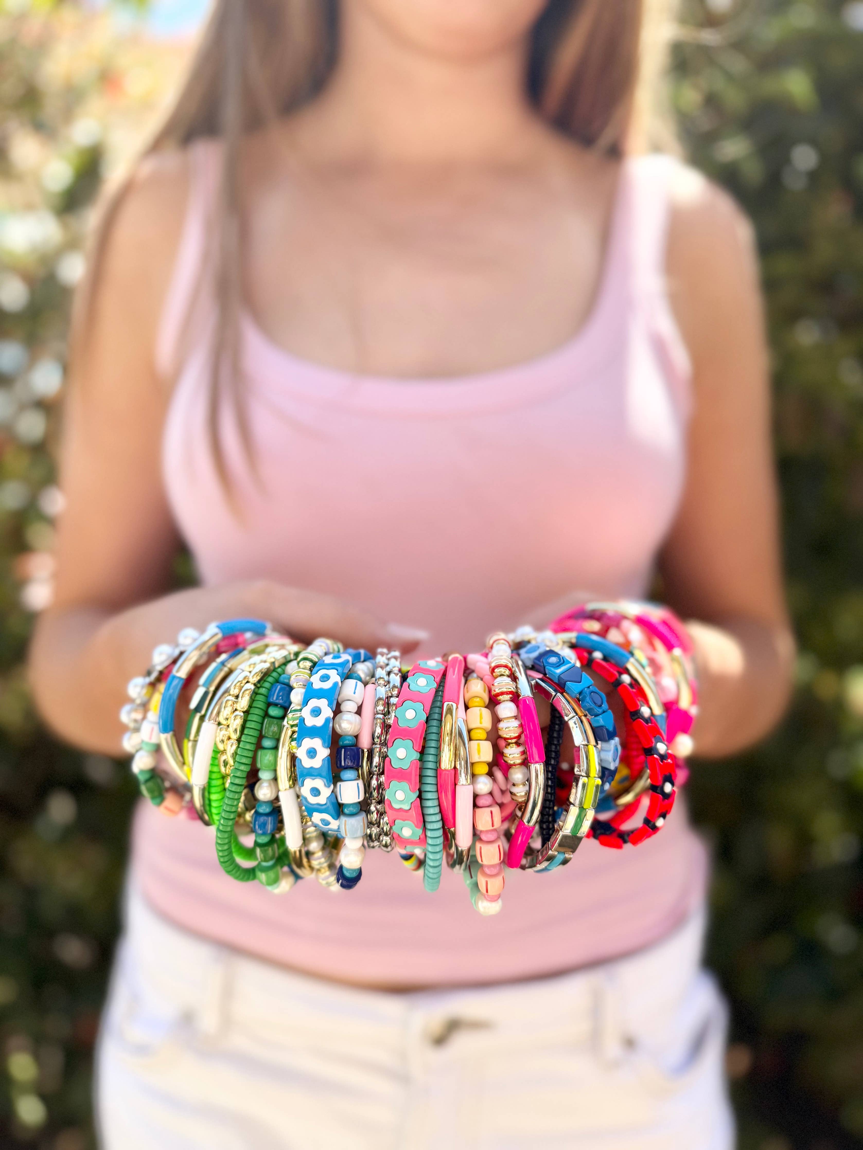 Colorful enamel stacking bracelet by Greenwood Designs featuring vibrant, multicolored enamel beads on a delicate metal chain.
