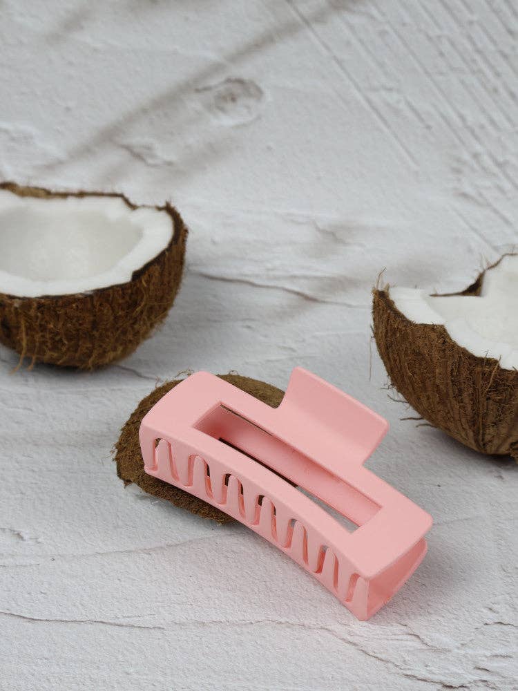 Medium elongated rectangle strawberry shortcake claw clip by Nakoa The Label, shown with glossy pink and red tones.
