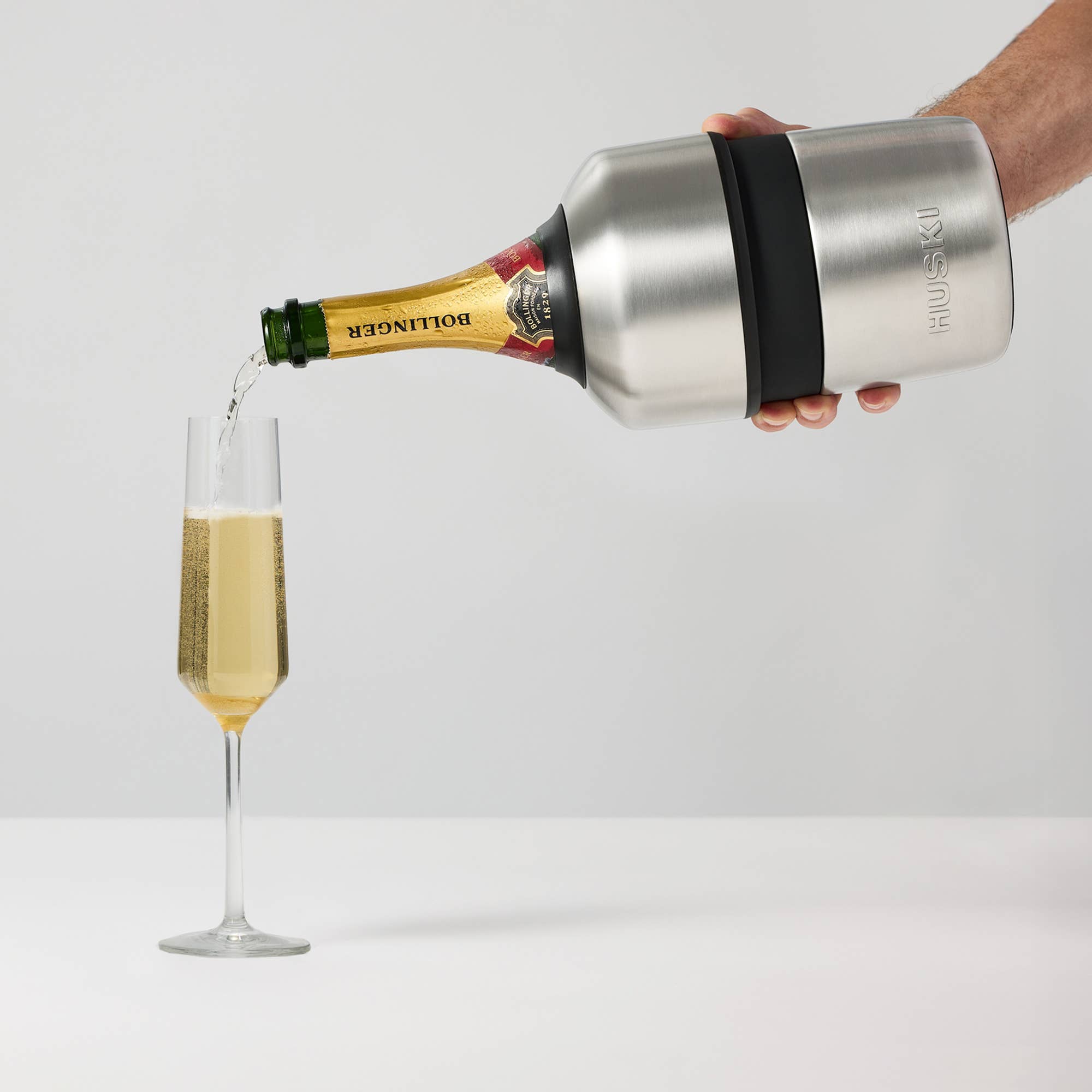 White Huski Champagne Cooler with sleek design, perfect for chilling bottles in a stylish and modern way.