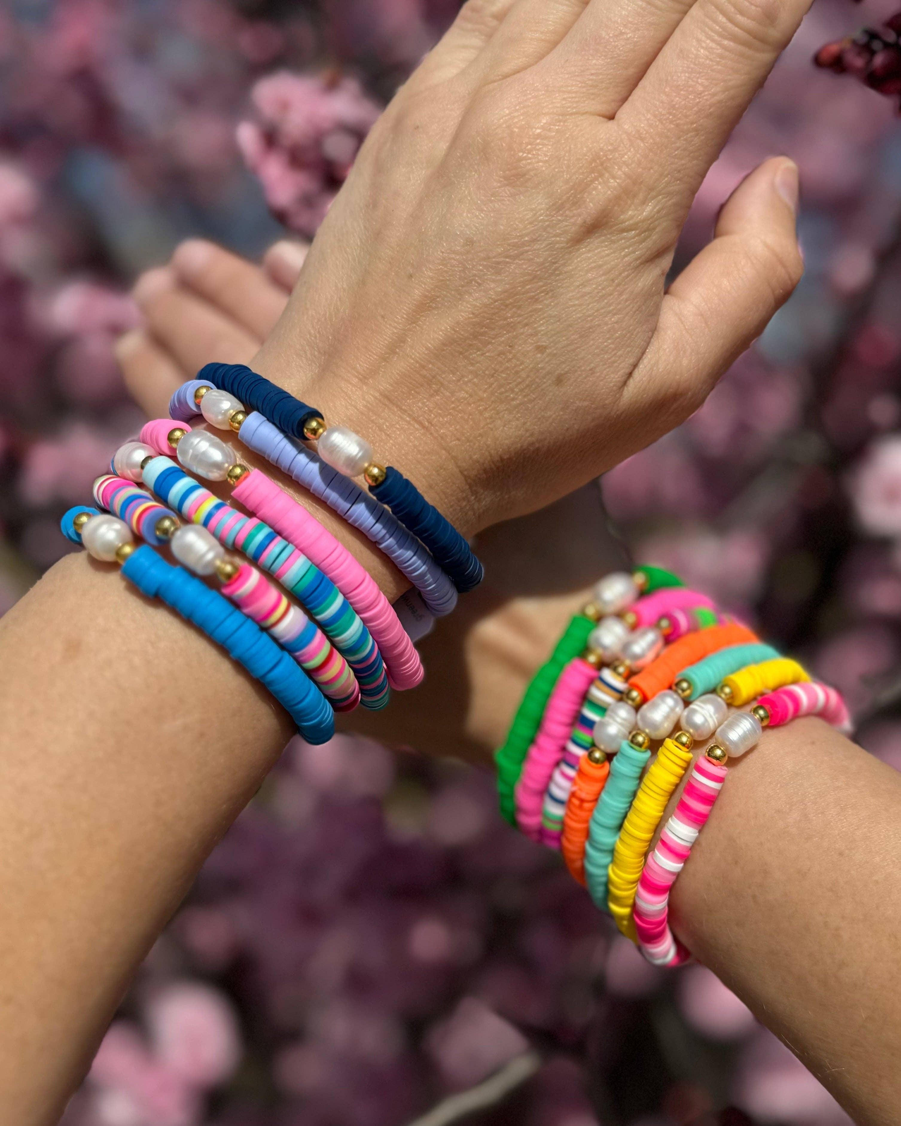 Pearl Pop Heishi Bead Bracelet by Greenwood Designs featuring white pearl and colorful heishi beads on an elastic band.
