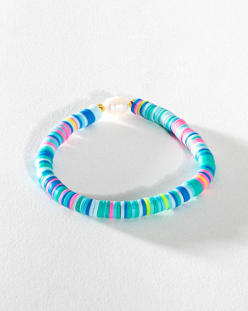 Pearl Pop Heishi Bead Bracelet by Greenwood Designs featuring white pearl and colorful heishi beads on an elastic band.