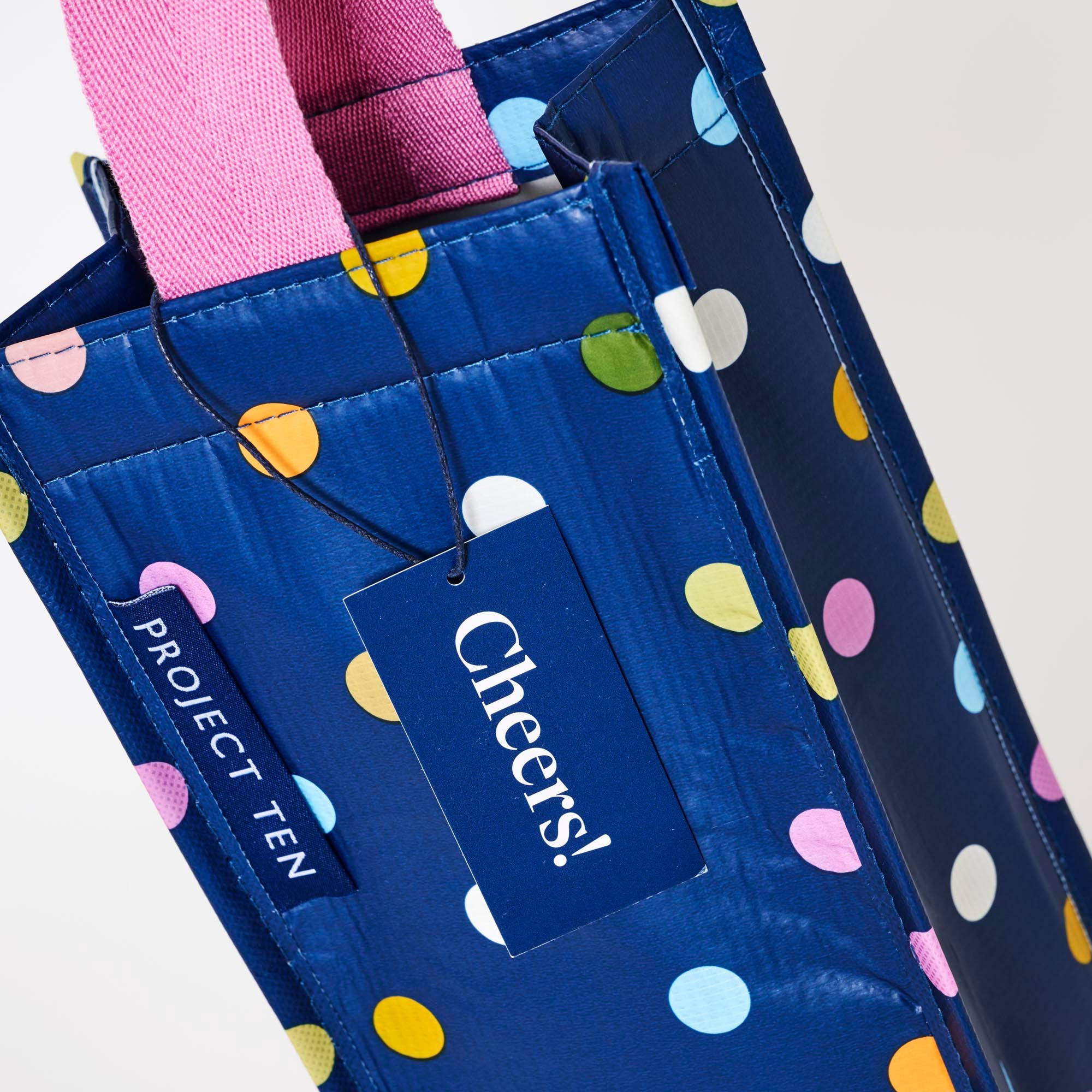 Wine bag with colorful confetti design by Project Ten Pty Ltd, made for carrying and gifting wine bottles elegantly.