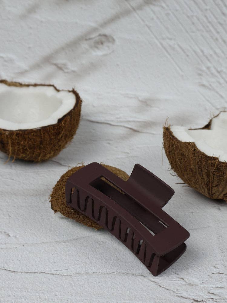 Medium elongated rectangle cocoa claw clip by Nakoa The Label, showing its smooth matte finish and sturdy metal spring.