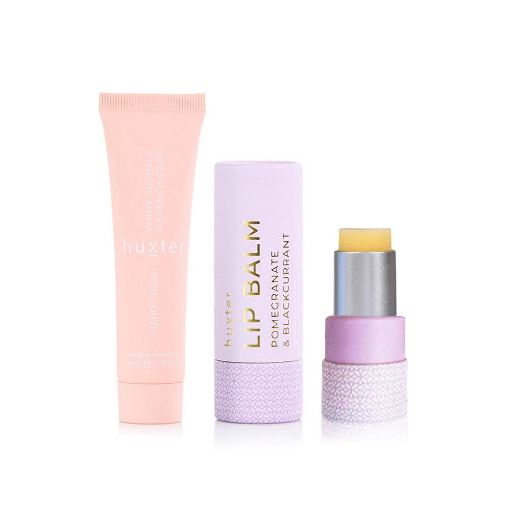 Huxter Lip & Hand Cream Duo in white floral and French pear scents, featuring elegant white floral packaging.