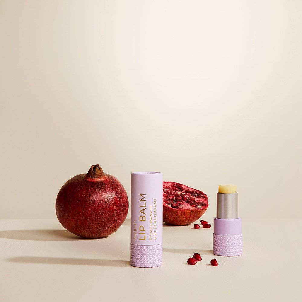 Huxter pomegranate and blackcurrant lip balm in mauve, 9g tube, showcasing a smooth, natural lip care product with fruity flavor.