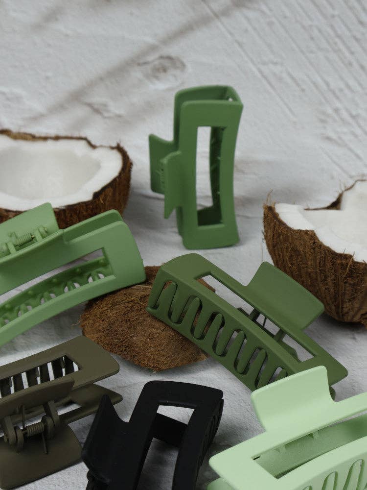 Medium elongated rectangle lime claw clip by Nakoa The Label, shown in a close-up image highlighting its bright color and sleek design.