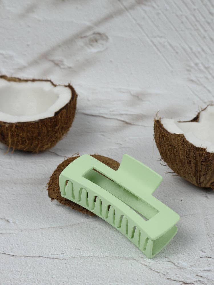 Medium elongated rectangle lime claw clip by Nakoa The Label, showing the bright, smooth plastic design in a close-up view.