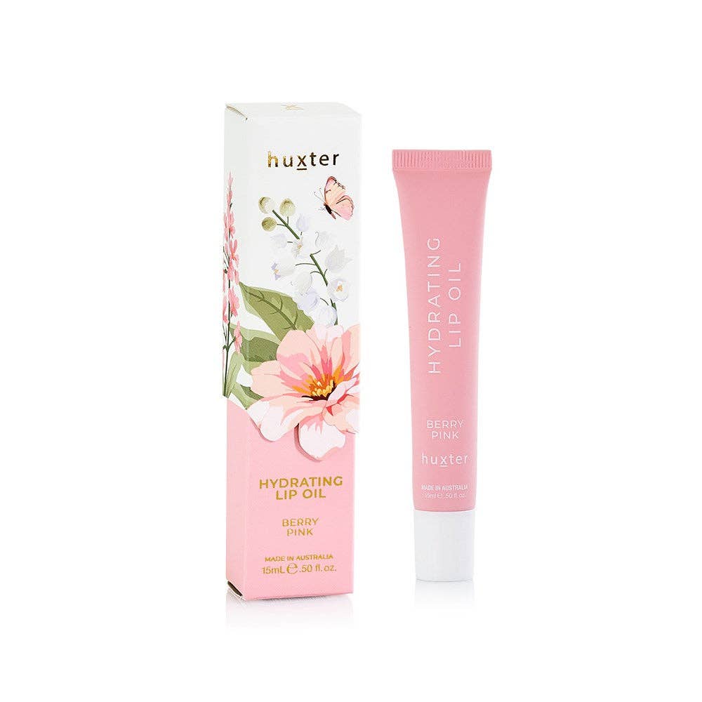Huxter 15ml hydrating lip oil in limited edition berry pink box, featuring glossy lip product with a sleek packaging design.