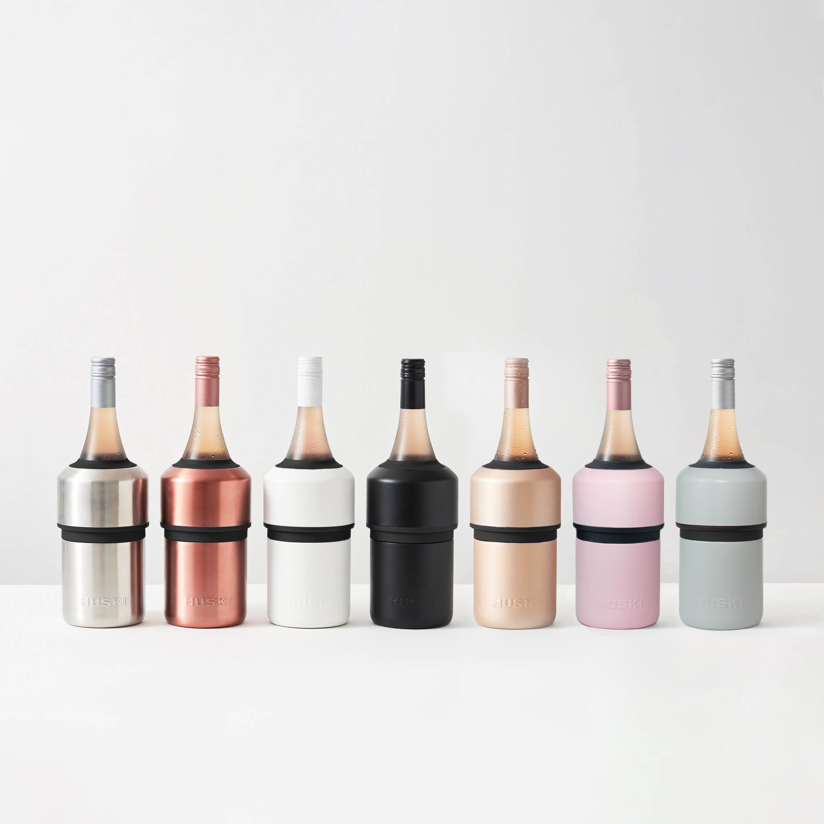 Huski Powder Pink Wine Cooler with sleek, insulated design for chilling wine bottles in a stylish, modern look.