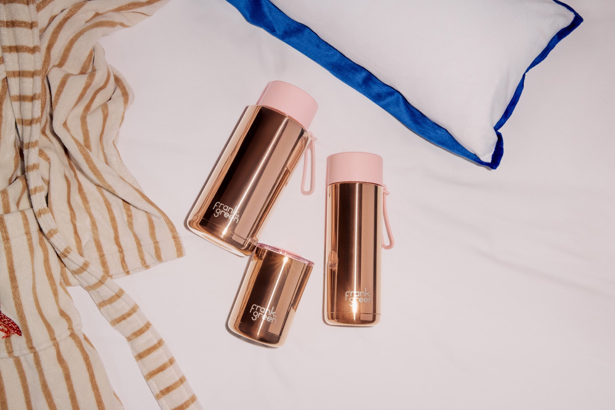 Frank Green 20oz rose gold chrome ceramic reusable water bottle with flip straw lid, featuring a sleek and stylish design.