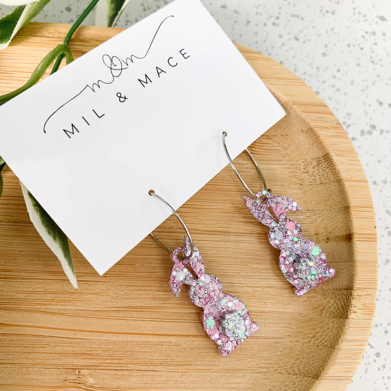 Small Easter cotton candy resin bunny hoop earrings featuring a cute cotton tail design by Mil & Mace.