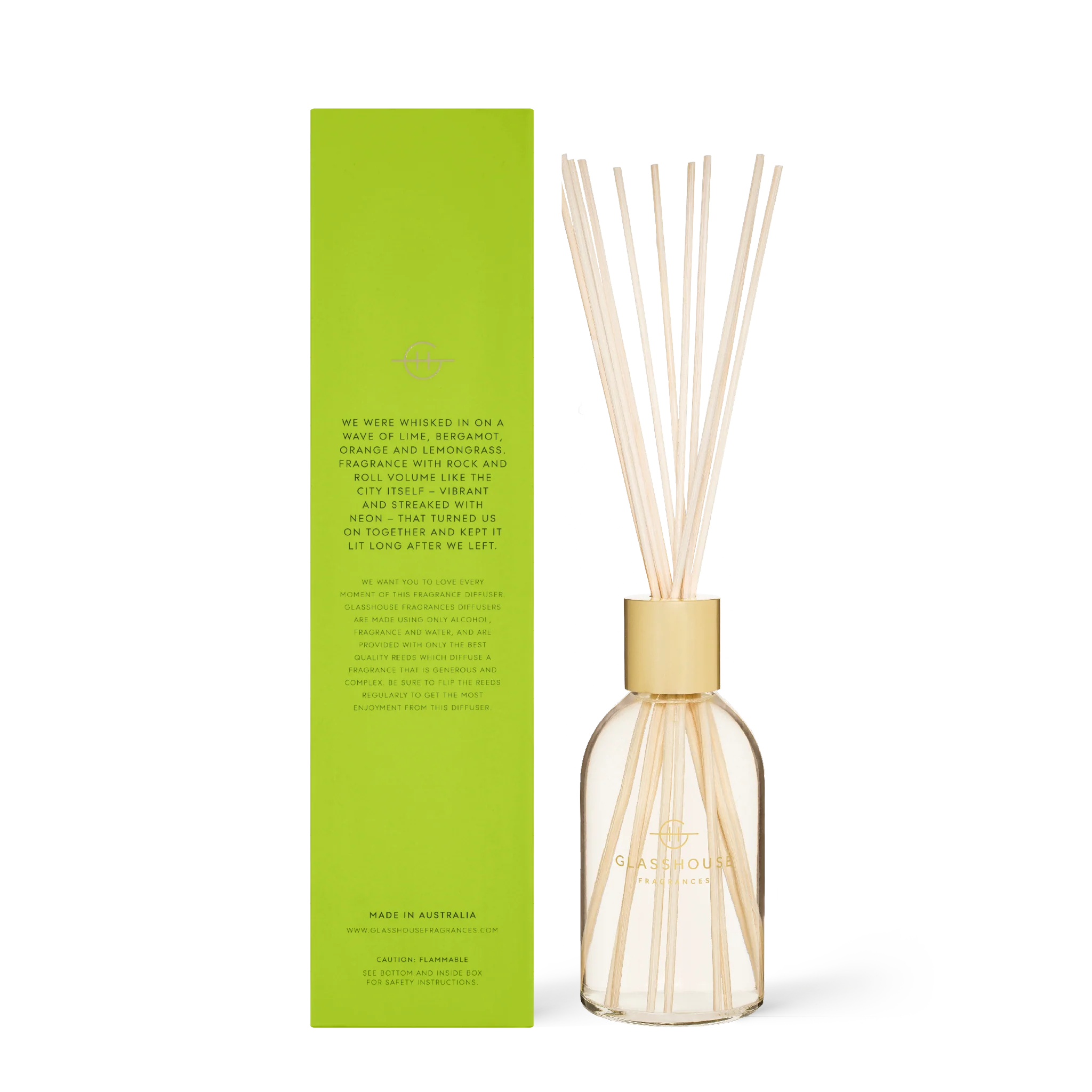 Glasshouse Fragrances We Met in Saigon diffuser with a sleek glass bottle and natural reed sticks on a neutral background.