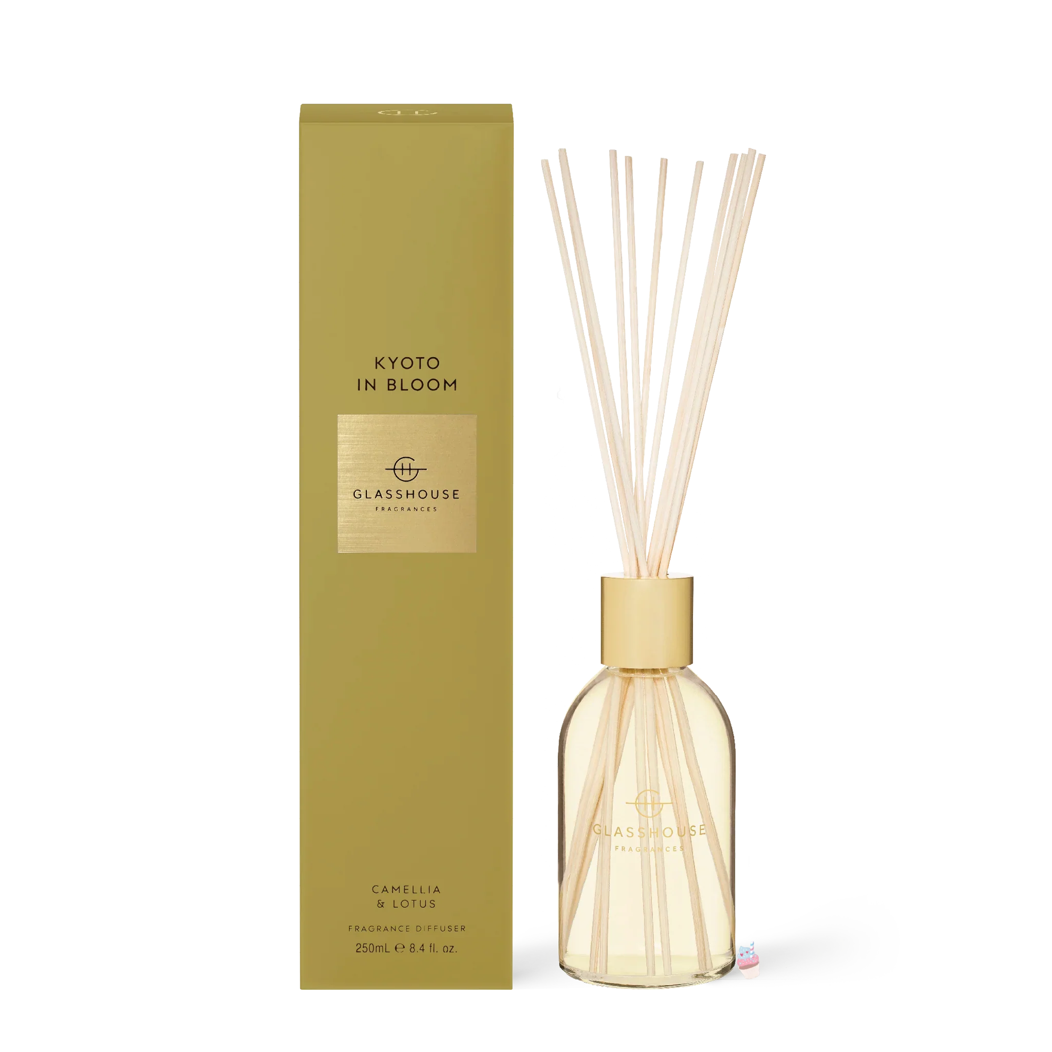 Glasshouse Fragrances Kyoto in Bloom diffuser with glass bottle and reed sticks, showcasing floral and citrus scent elements.