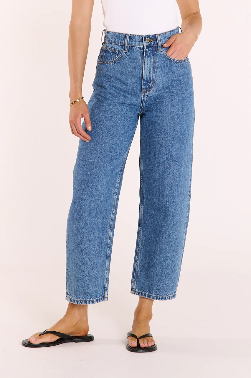Feather + Noise Lola Cropped Barrel Jeans in deep blue denim, showing the high-waisted, relaxed fit with rolled hems and classic five-pocket style.