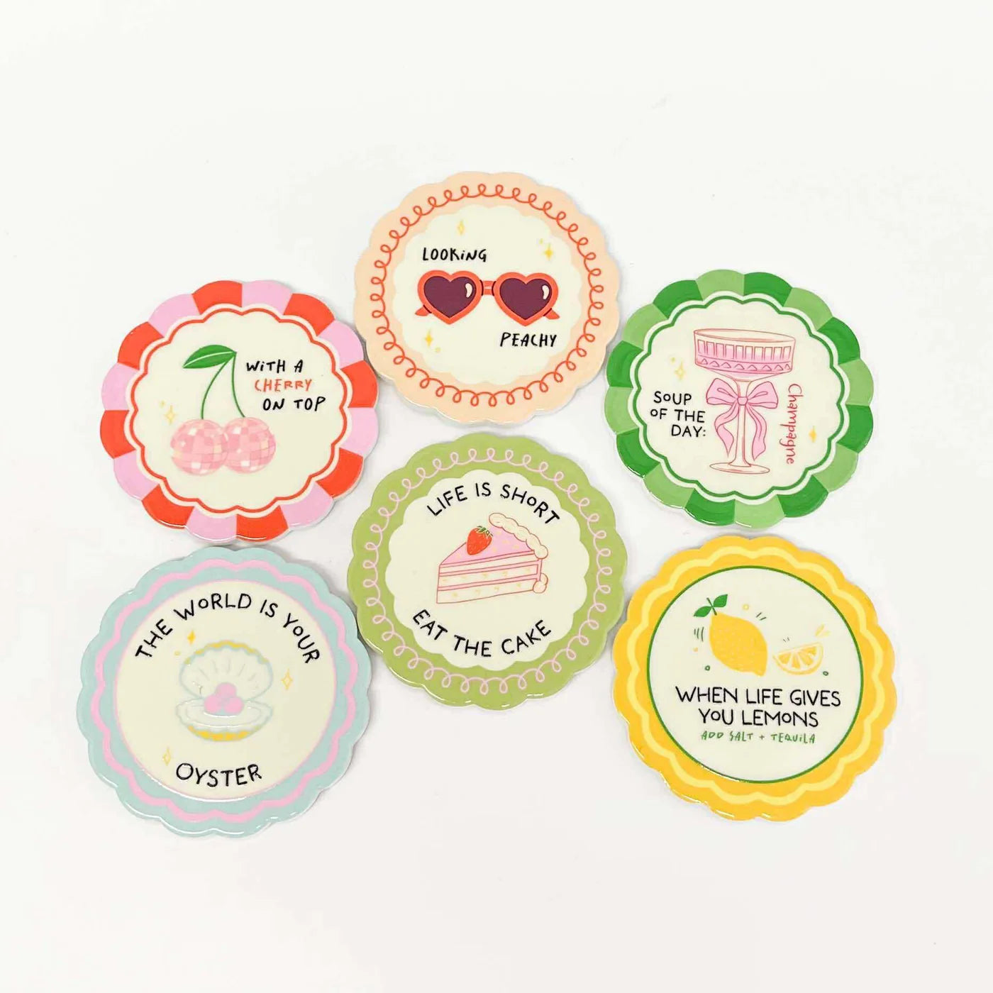 Coast to Coast Proverb ceramic coasters with engraved inspirational quote, set of four, featuring colorful, decorative designs.