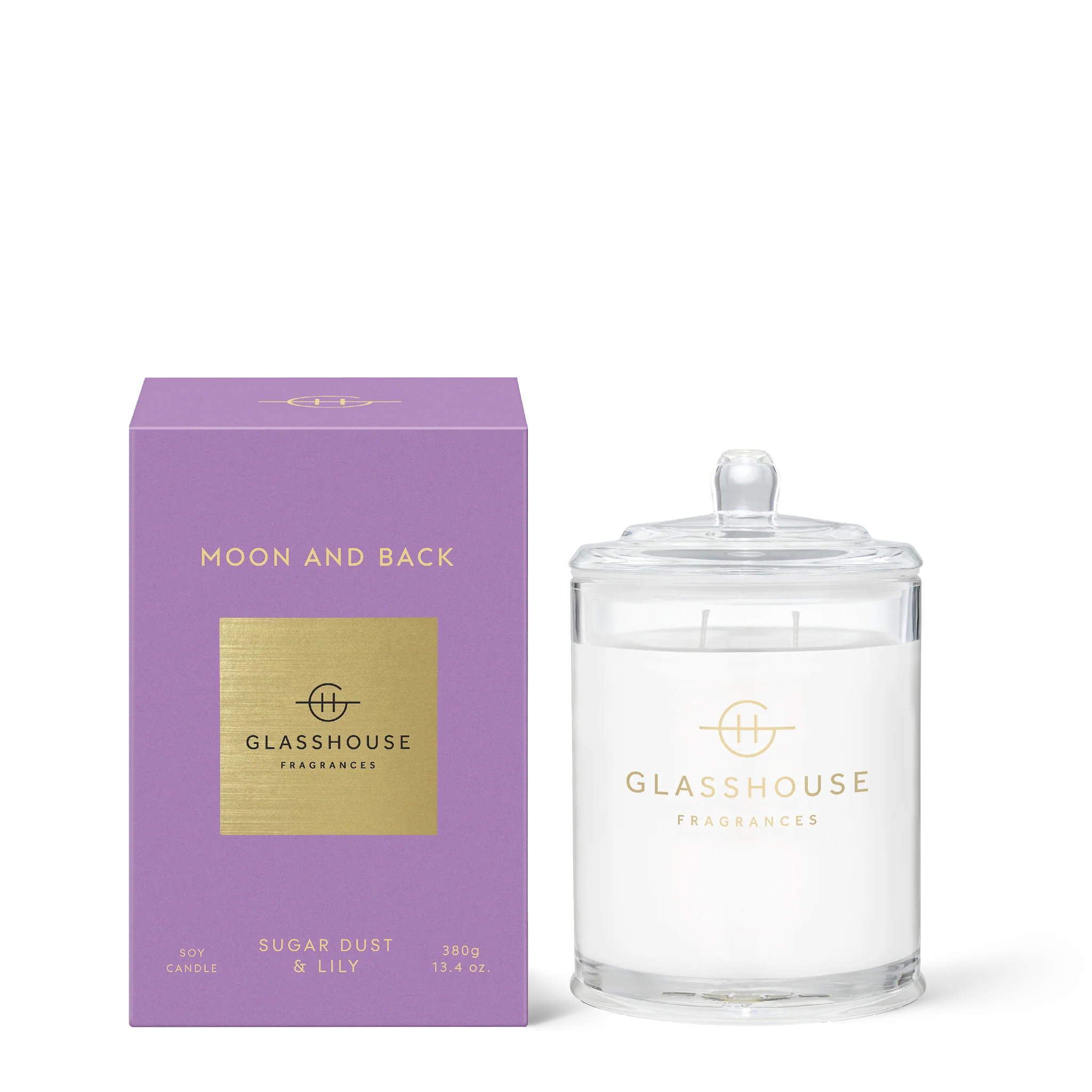 Glasshouse Fragrances Moon and Back soy candle in a 380g glass jar, with a lit wick and a warm, inviting glow.