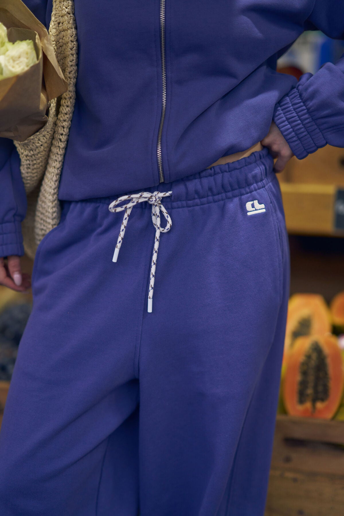 Ceres Life Jenna tapered trackpants in washed navy fabric, featuring a relaxed fit with elastic waistband and cuffed ankles.