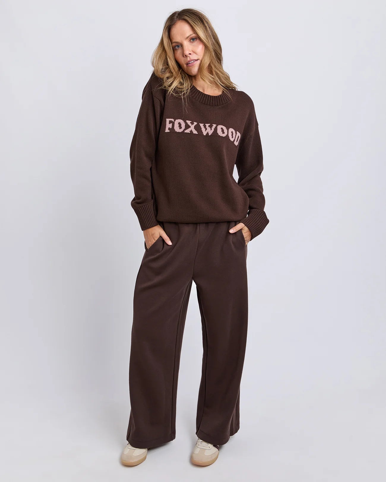 Foxwood Taylor Knit Coffee Bean sweater displayed on a hanger, showcasing its soft knit fabric and cozy coffee bean color.