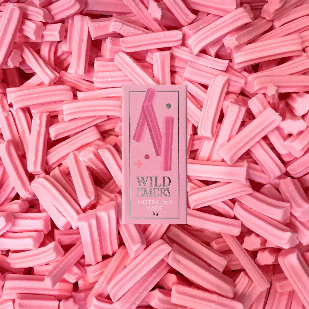 Wild Emery Musk Sticks Mini Lip Balm in Wild Emery flavor, showing the small tube with the balm inside.
