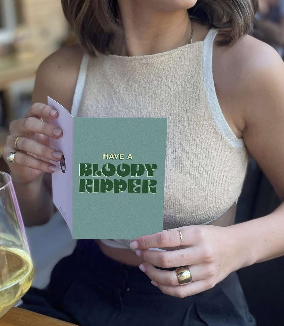 Green birthday greeting card featuring a bloody ripper design by Bad on Paper, with bold text and artistic illustration.