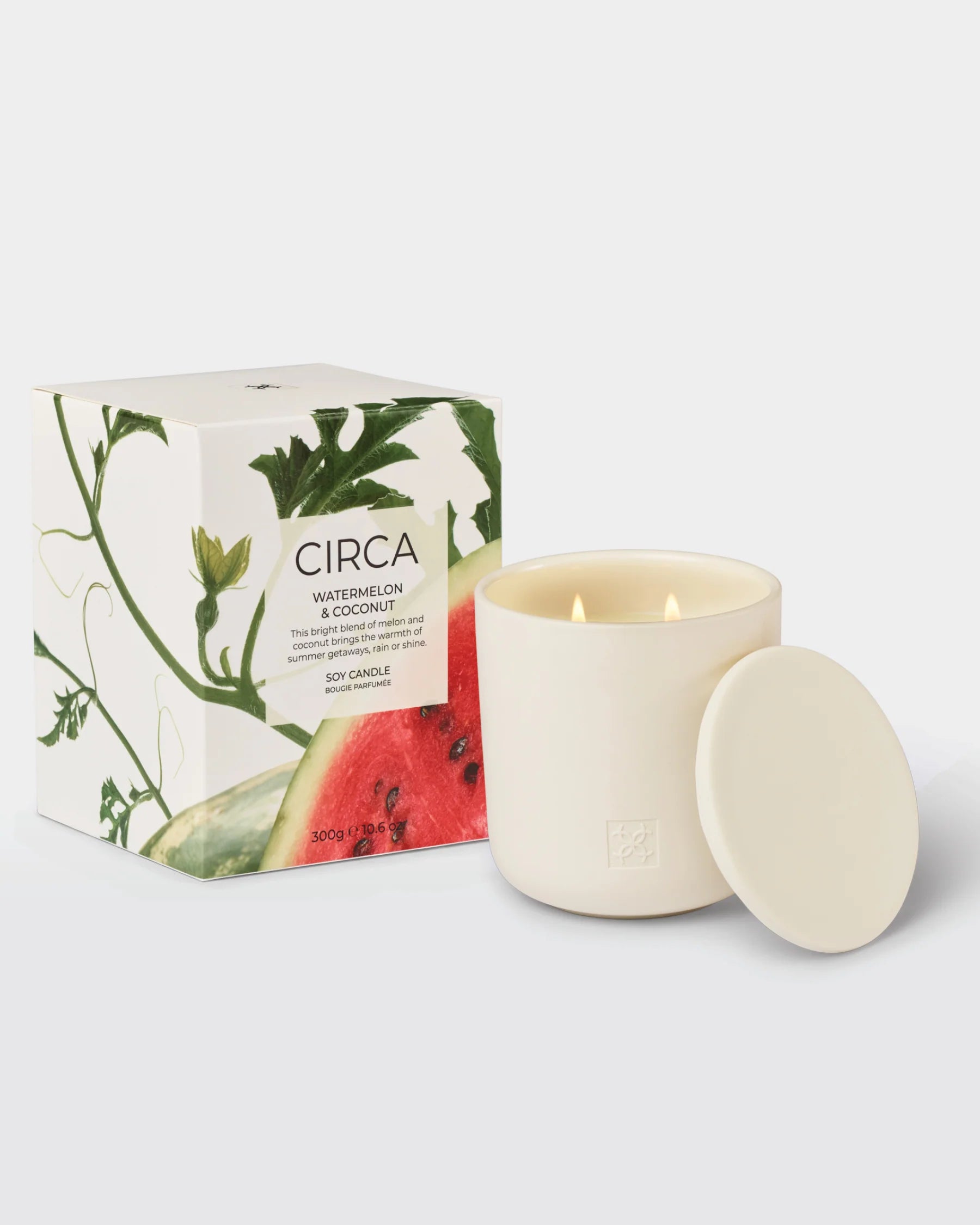 Circa Watermelon & Coconut soy candle in 300g jar, with a vibrant pink and green candle and a tropical fruit-themed label.
