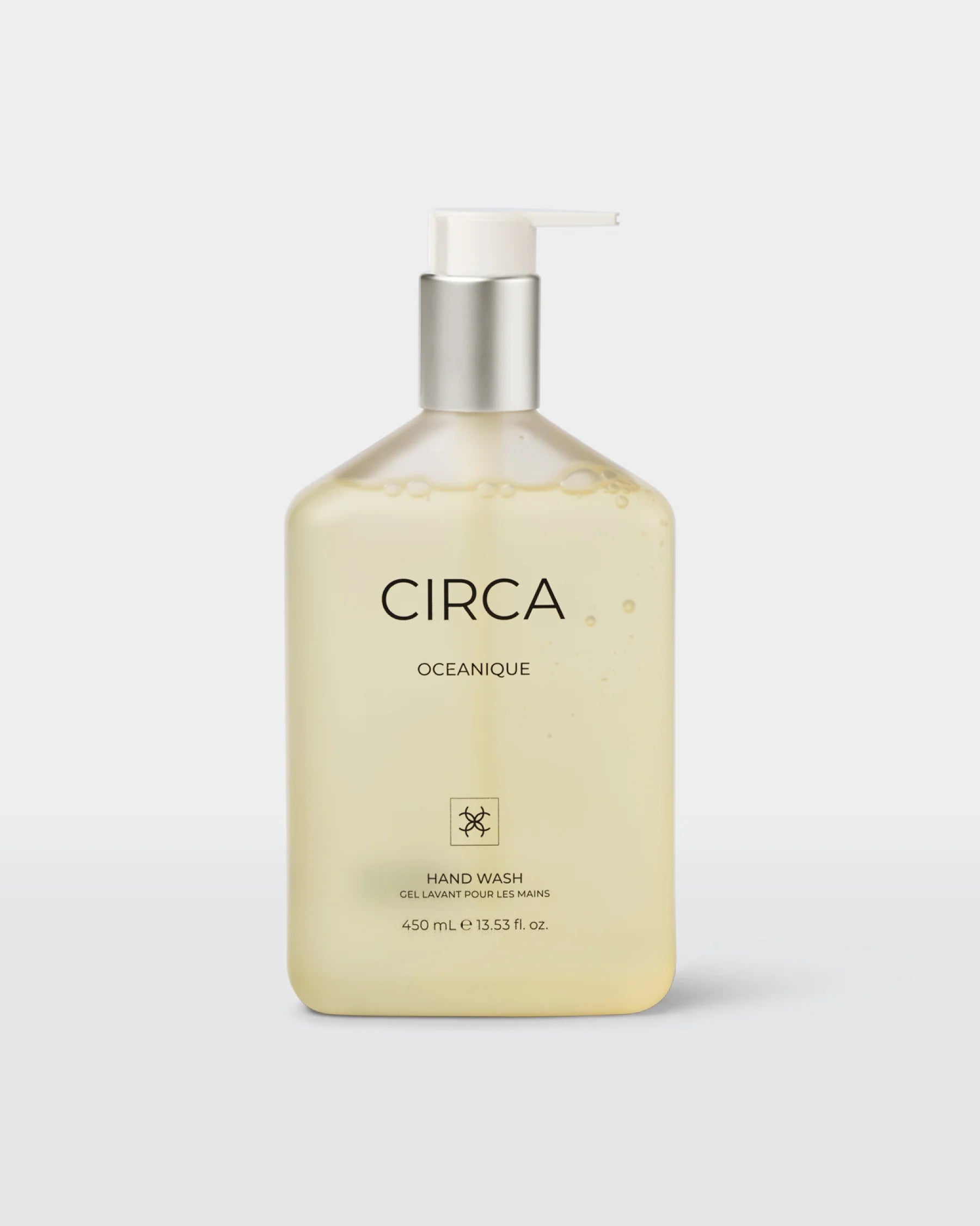 Circa OCEANIQUE Hand Wash 450ml bottle with a sleek design and label, featuring a marine-inspired theme and clear liquid soap inside.