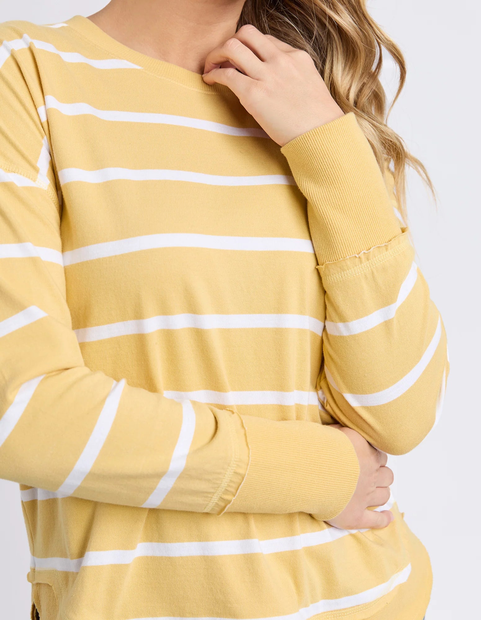 Foxwood Farrah Stripe Long Sleeve shirt in butter and white stripes, shown laid flat with visible neckline and sleeve details.