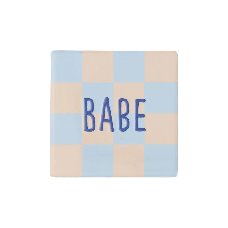 Assemble& Moniker ceramic coaster with a stylish design, featuring a smooth surface and rounded edges.