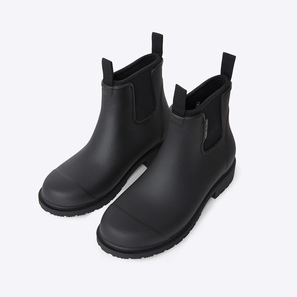Black Bobbi Ankle Boot by Merry People featuring sleek black leather and a stylish, modern ankle-high design.