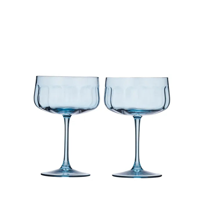 Set of two Assemble Denim coupe glasses with clear glass bowls and short stems, perfect for serving cocktails.