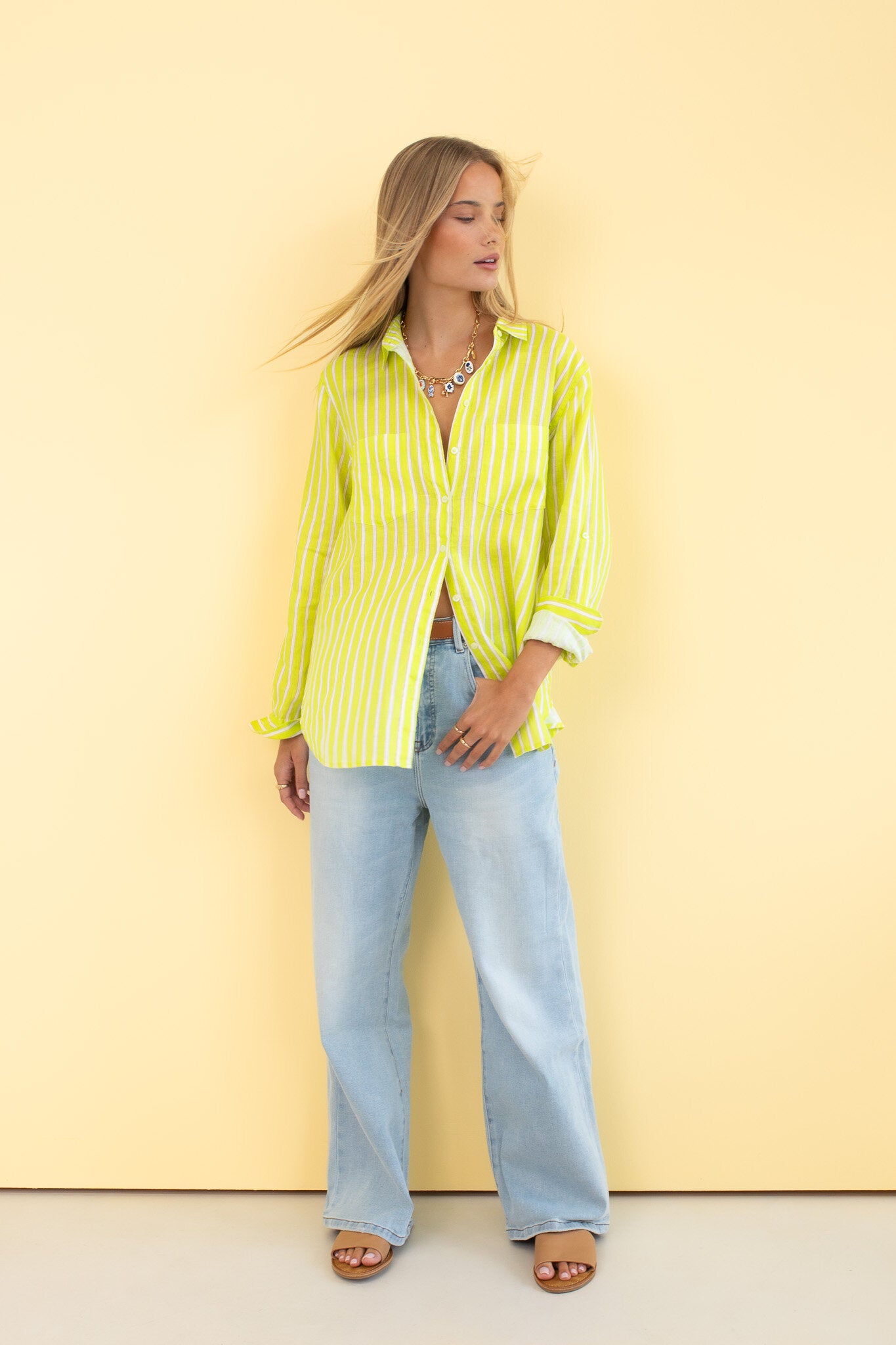 Piney Limey Stripe Boyfriend Linen Shirt by Hut Clothing, featuring lightweight fabric and casual relaxed fit, displayed on a hanger.