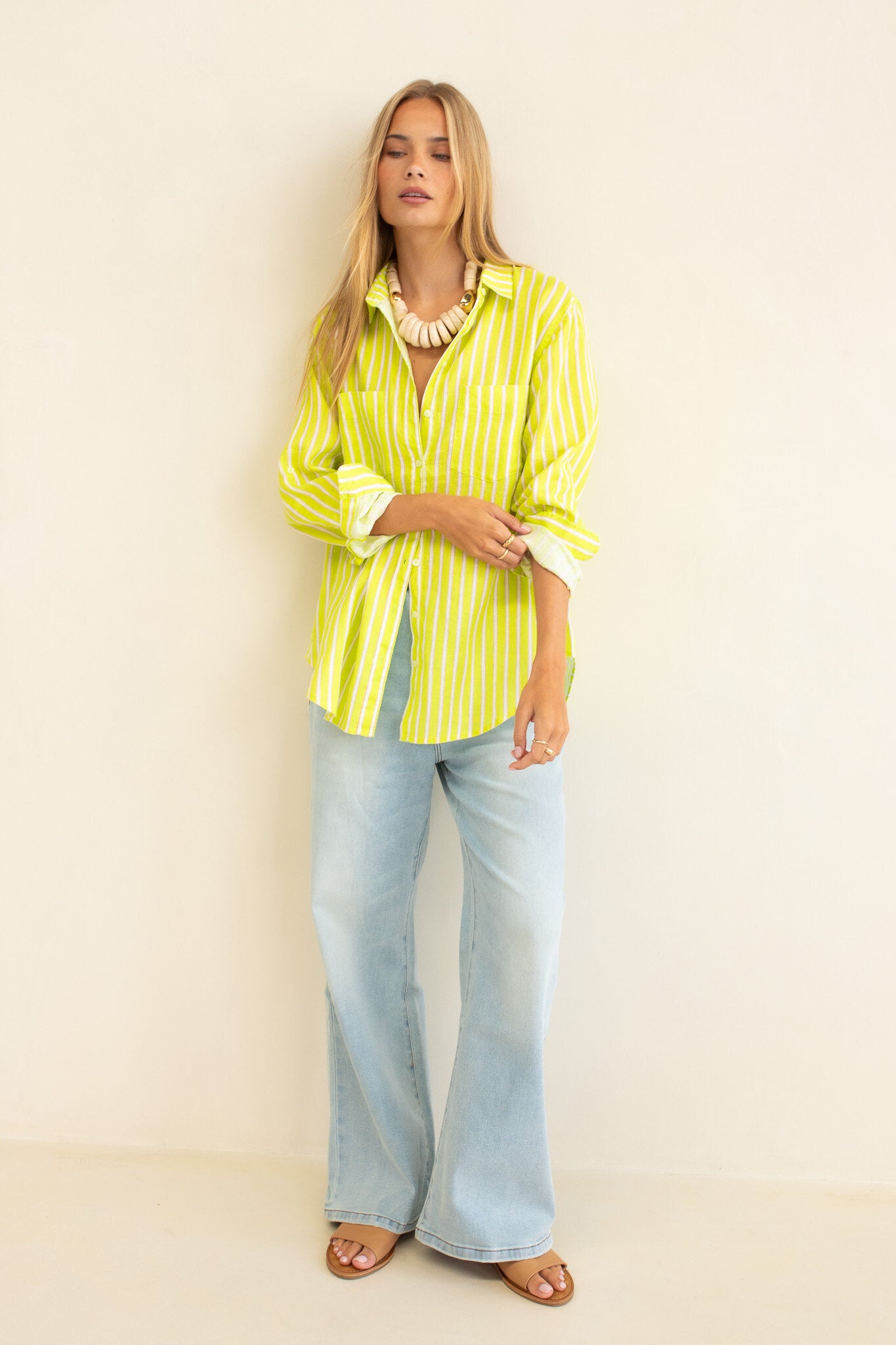 Piney Limey Stripe Boyfriend Linen Shirt by Hut Clothing, showing a relaxed fit with green and white stripes on lightweight linen fabric.