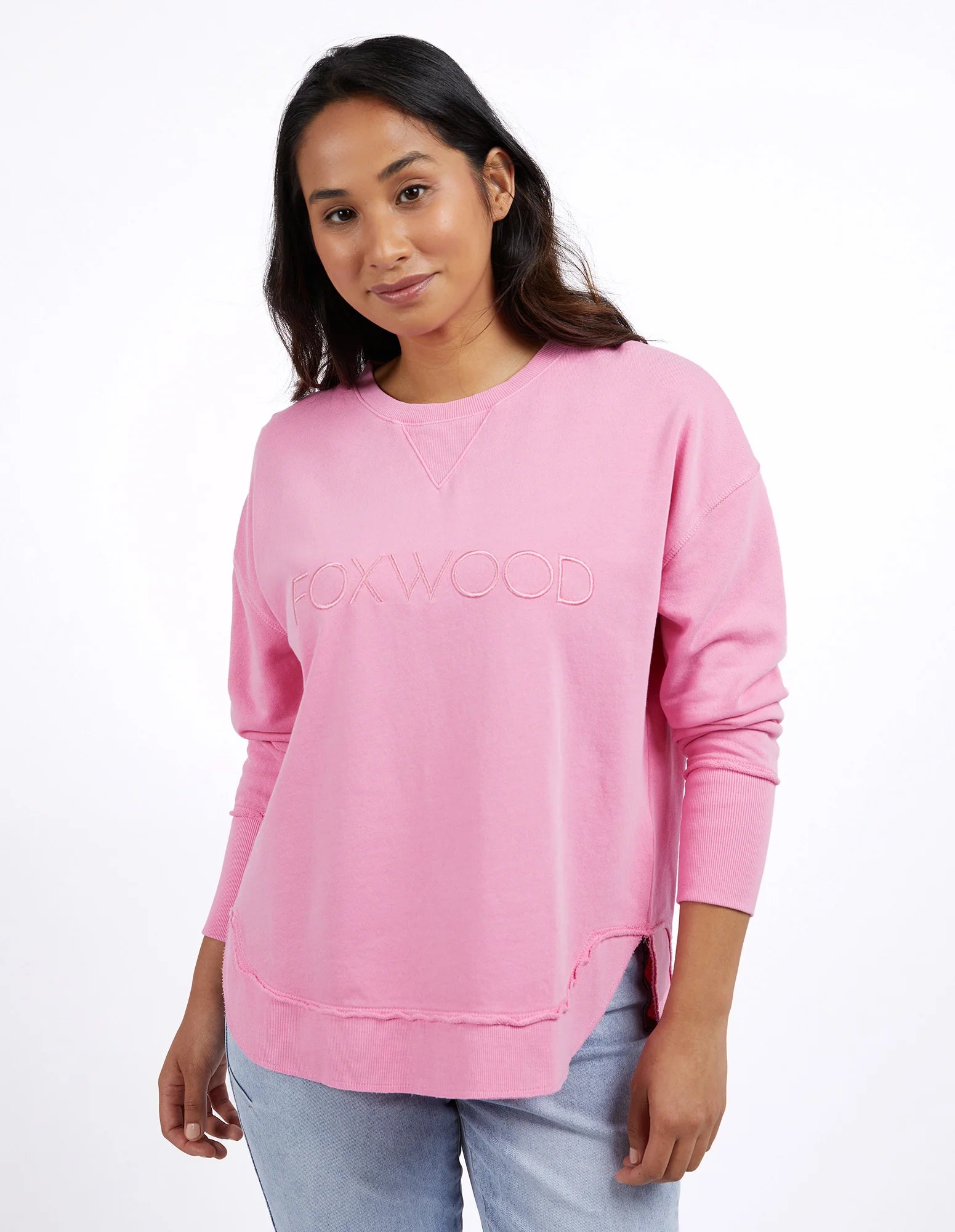 Foxwood Simplified Crew Bubblegum Pink sweater displayed on a model, showcasing soft fabric and relaxed fit.