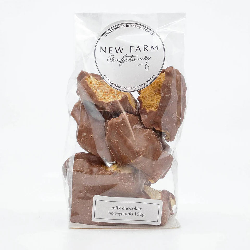 Milk chocolate honeycomb in a 150g New Farm package, showing golden honeycomb pieces coated in smooth milk chocolate.