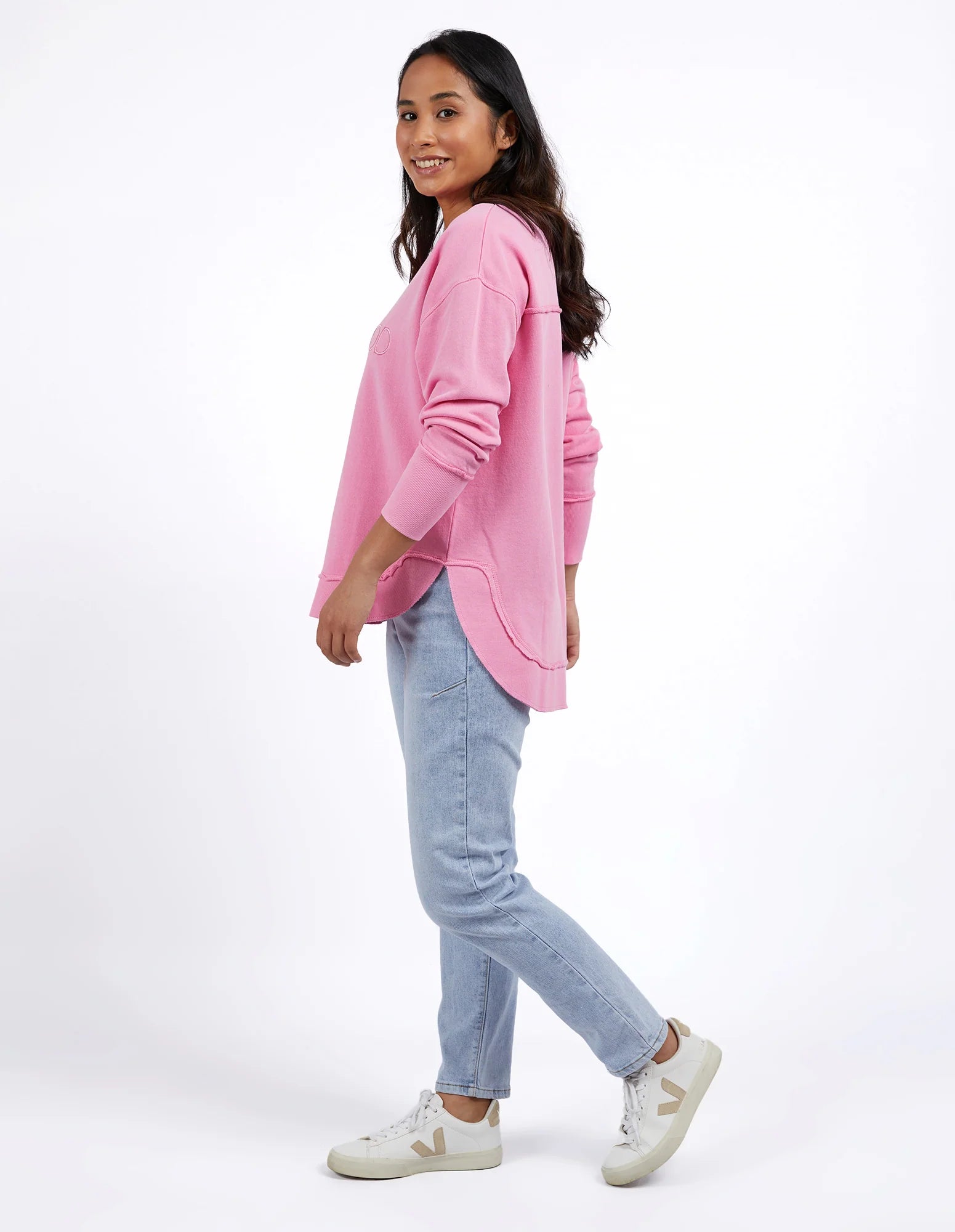Foxwood Simplified Crew Bubblegum Pink sweater displayed on a hanger with a soft, cozy knit texture.