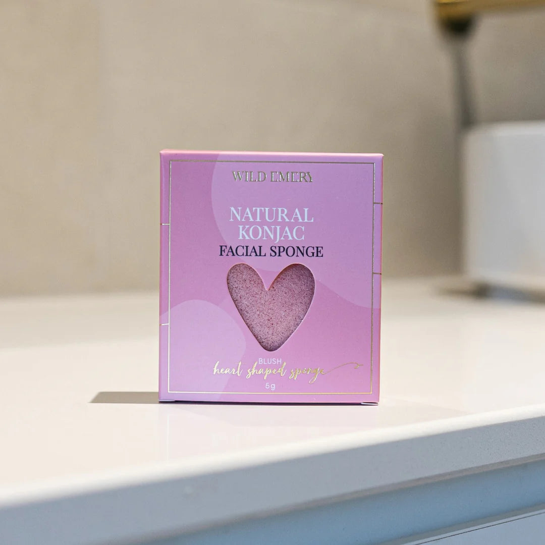 Wild Emery Blush Konjac Sponge by Wild Emery, showing a soft, pink exfoliating facial sponge with a natural fiber texture.