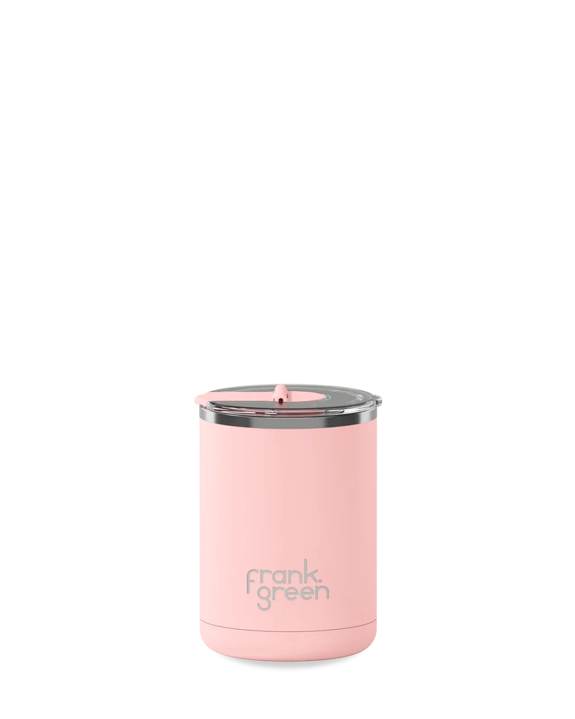 Frank Green ceramic coffee cup with hinged lid in blush color, showcasing a sleek design and smooth finish.