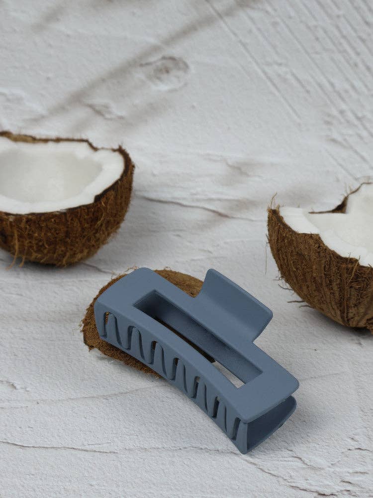 Medium elongated rectangle stone claw clip from Nakoa The Label, featuring a stylish, natural stone finish for hair styling.