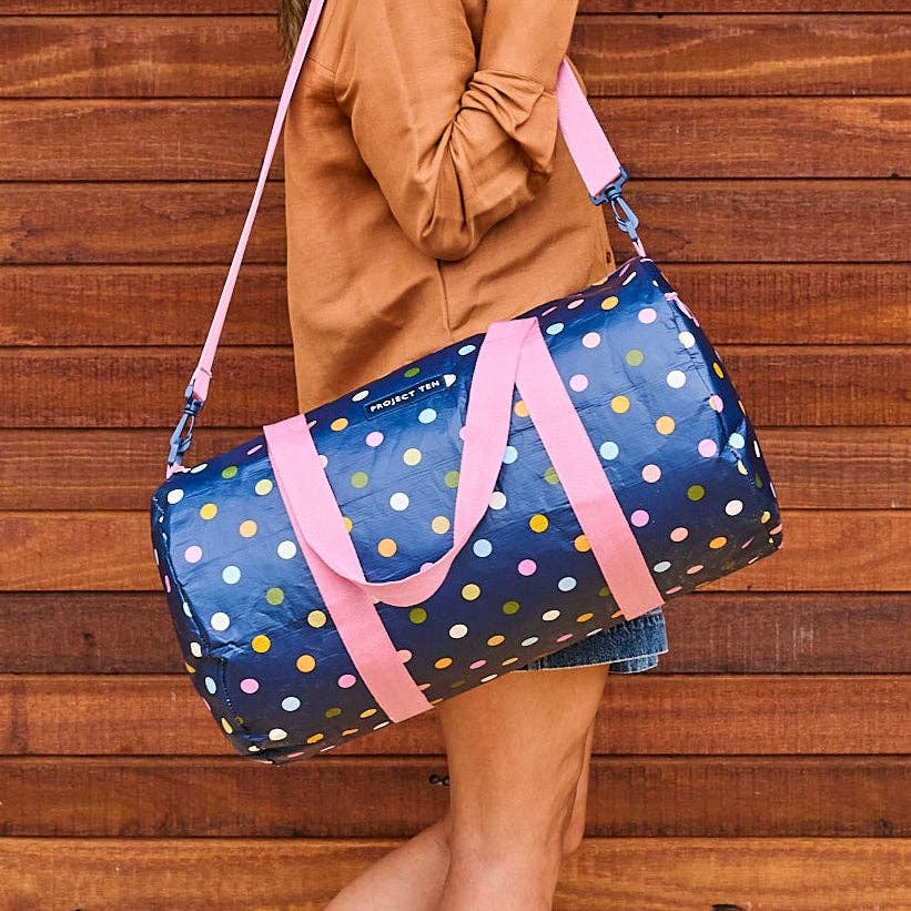 Project Ten Confetti Barrel Bag with colorful confetti pattern and sturdy leather handles, stylish and spacious for everyday use.
