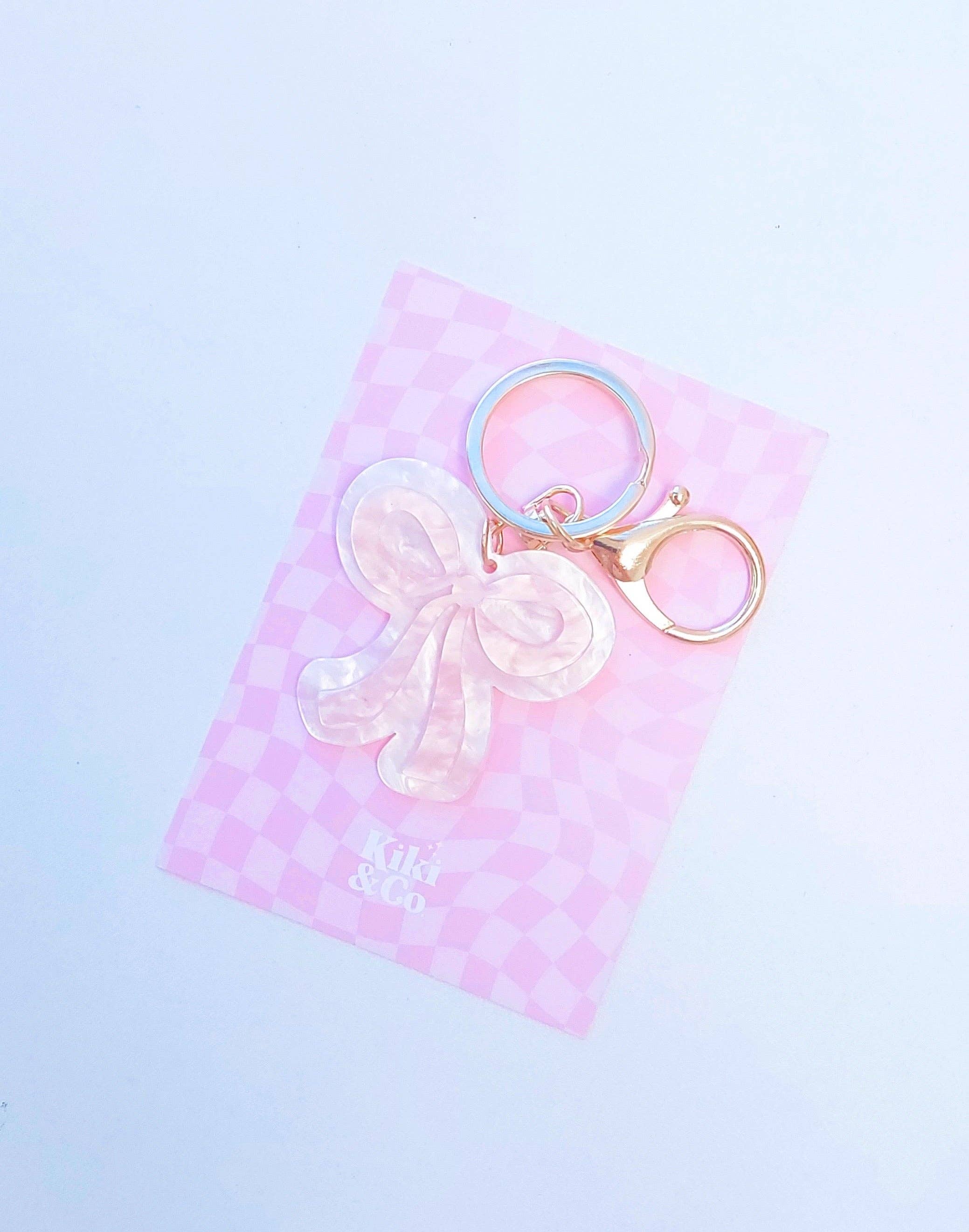 Kiki & Co. bow keyring with a cute fabric bow attached to a metal keyring, perfect for keys or accessories.