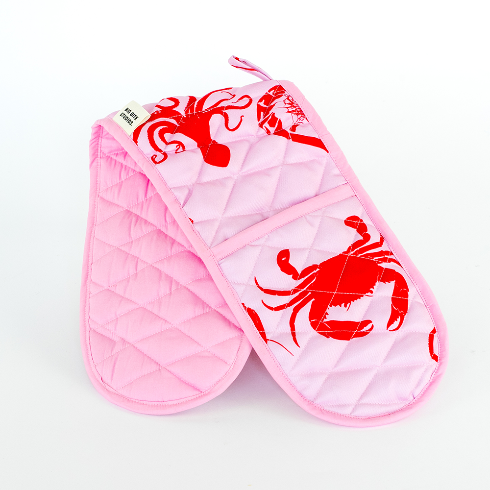 Big Bite Studios Happy Pouch Club double oven mitt featuring a bright, colorful pattern for kitchen protection.