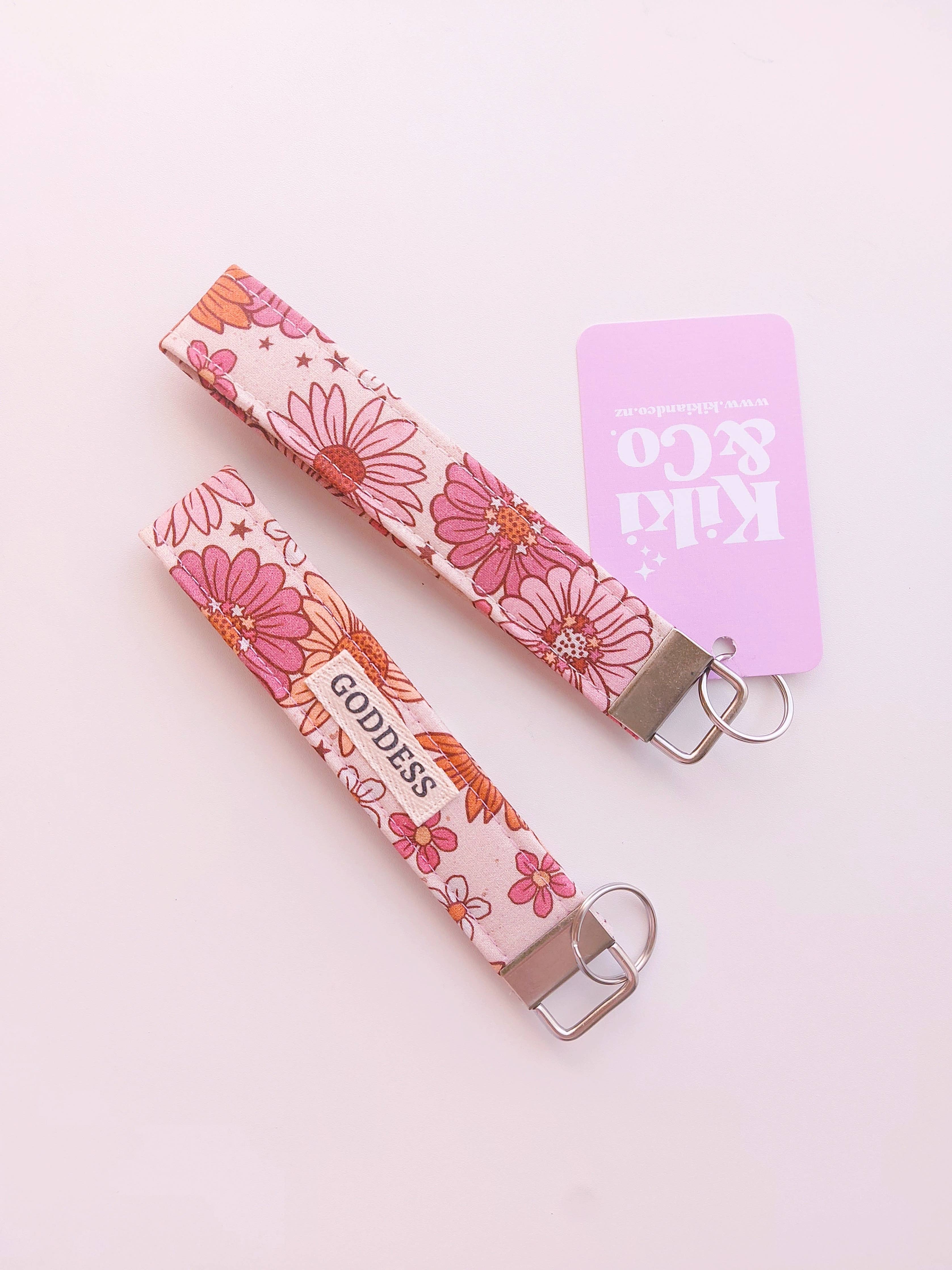 Kiki & Co. fall floral keychain with colorful autumn leaves and floral accents, decorative accessory on a keyring.