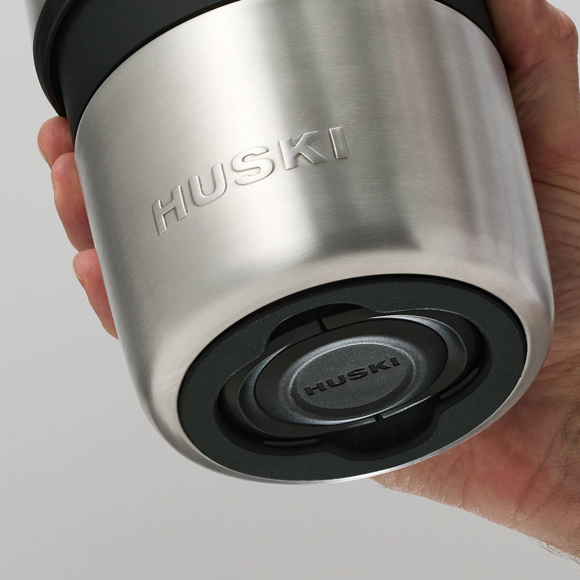 Huski Champagne Cooler in white, insulated stainless steel with handle for keeping champagne bottles chilled.