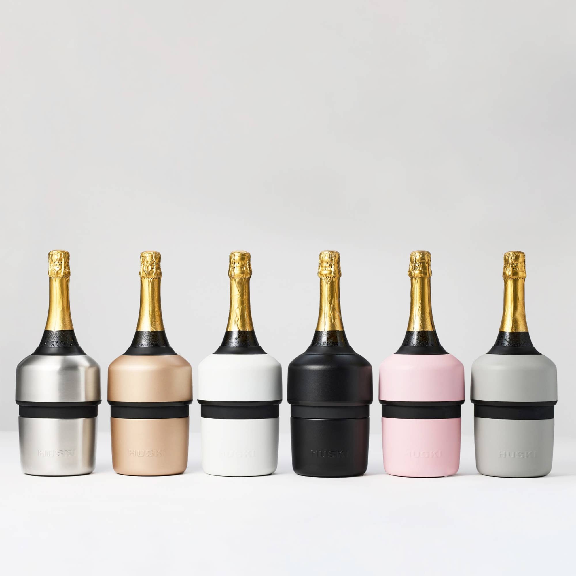Huski white champagne cooler with sleek design, made of durable insulated material, perfect for keeping bottles chilled.