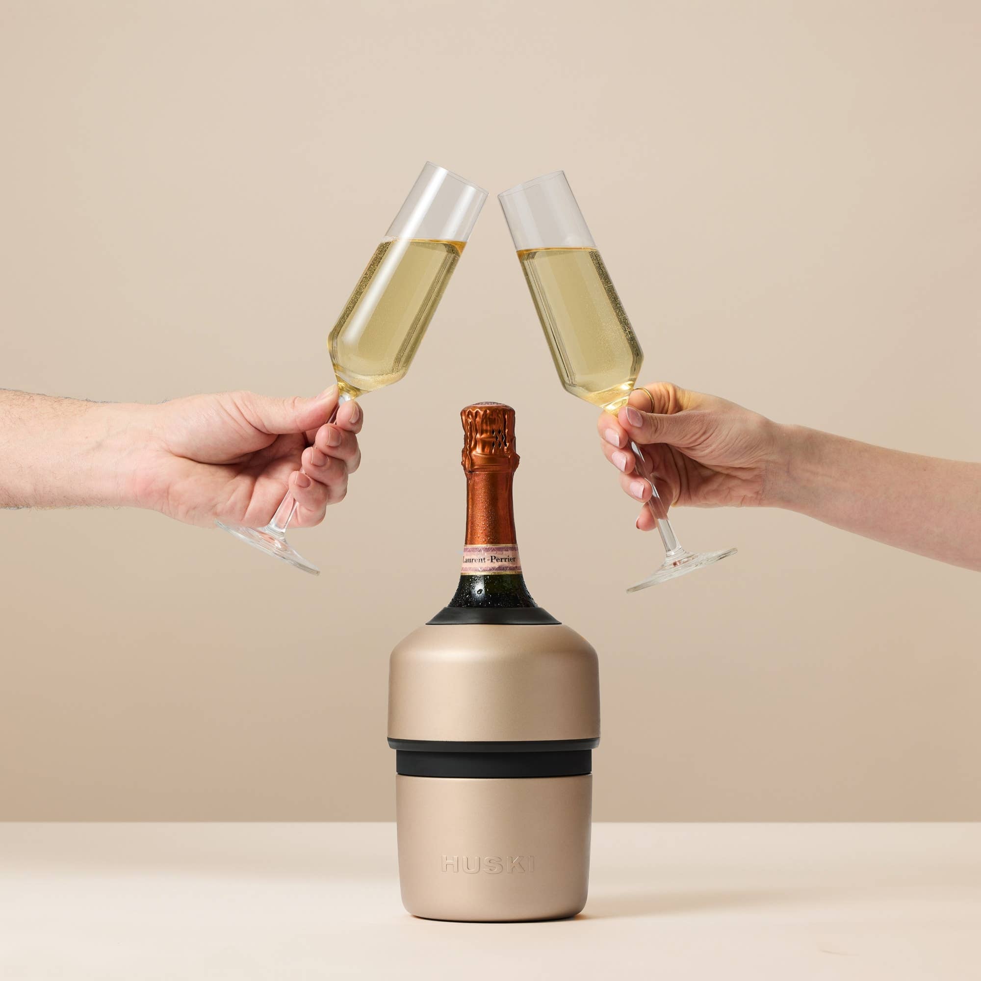 Huski Champagne Cooler in white, insulated stainless steel with a sleek design, perfect for keeping champagne chilled.