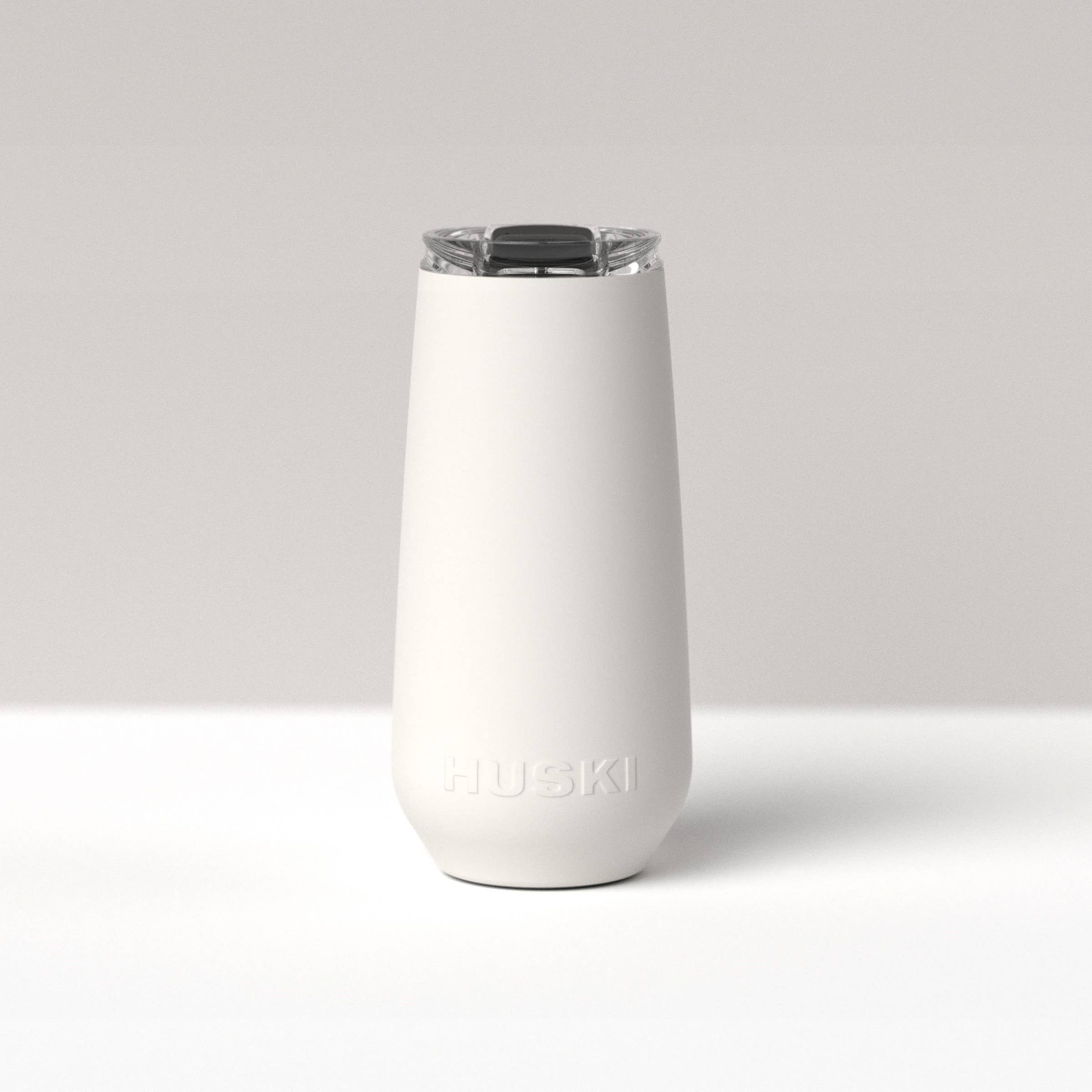 Huski Champagne Flute in white, clear glass with a sleek, modern design for elegant champagne serving.