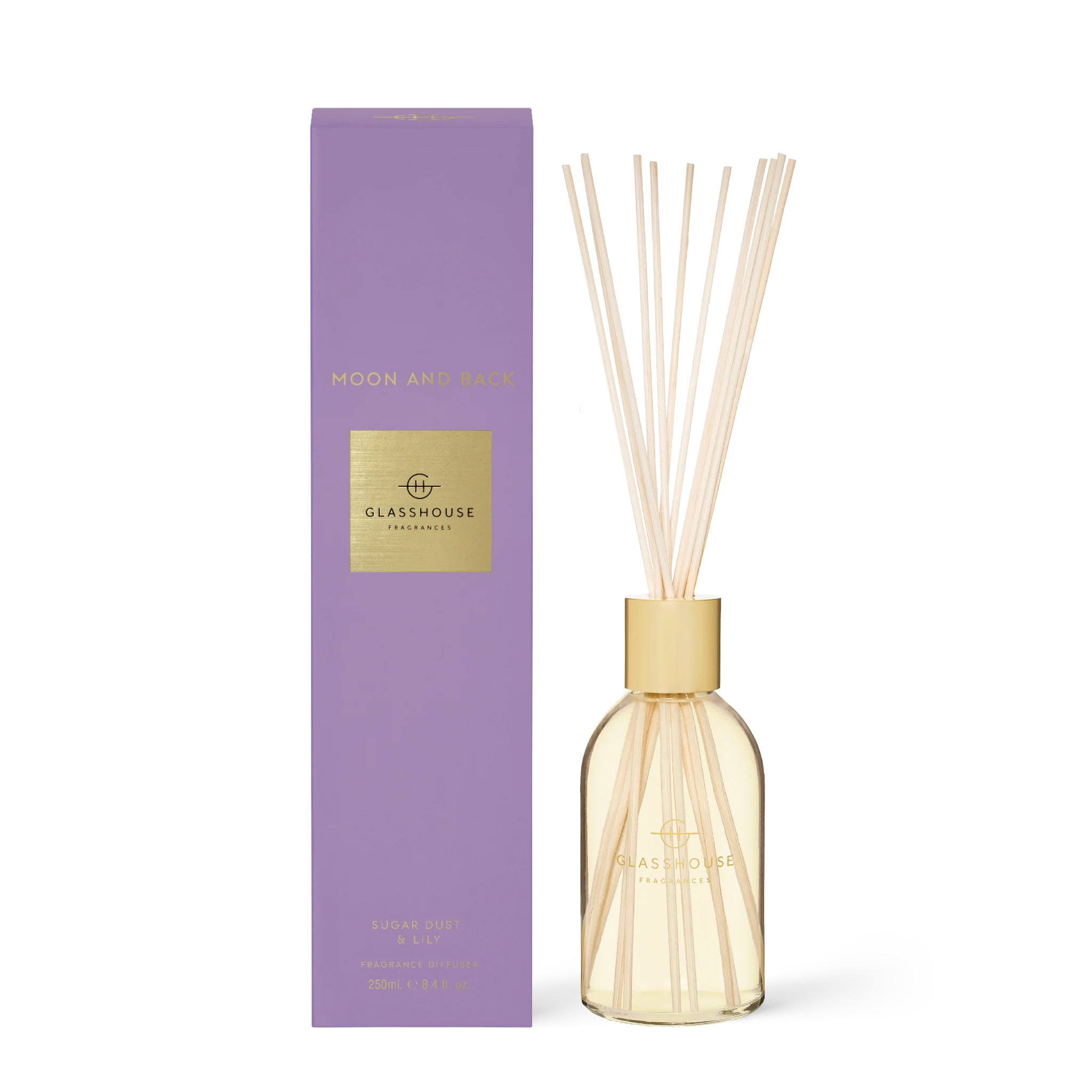 Glasshouse Fragrances Moon and Back diffuser with clear glass bottle and reed sticks for home fragrance.