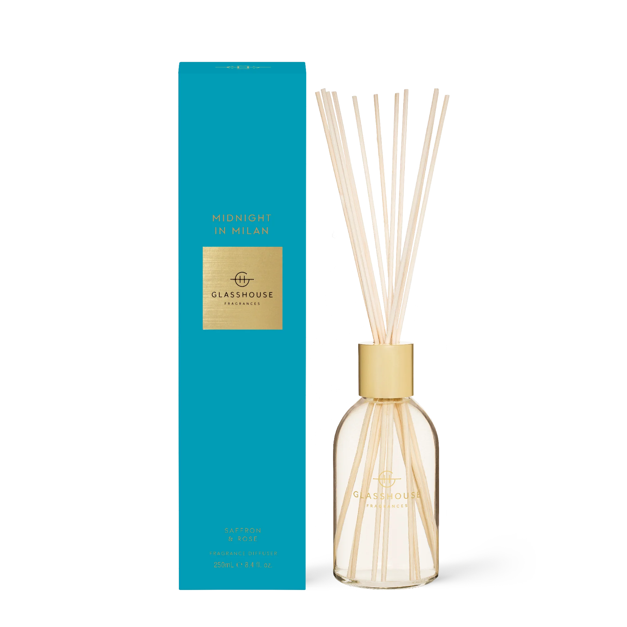 Glasshouse Fragrances Midnight in Milan diffuser with sleek glass bottle and reed sticks for home fragrance.