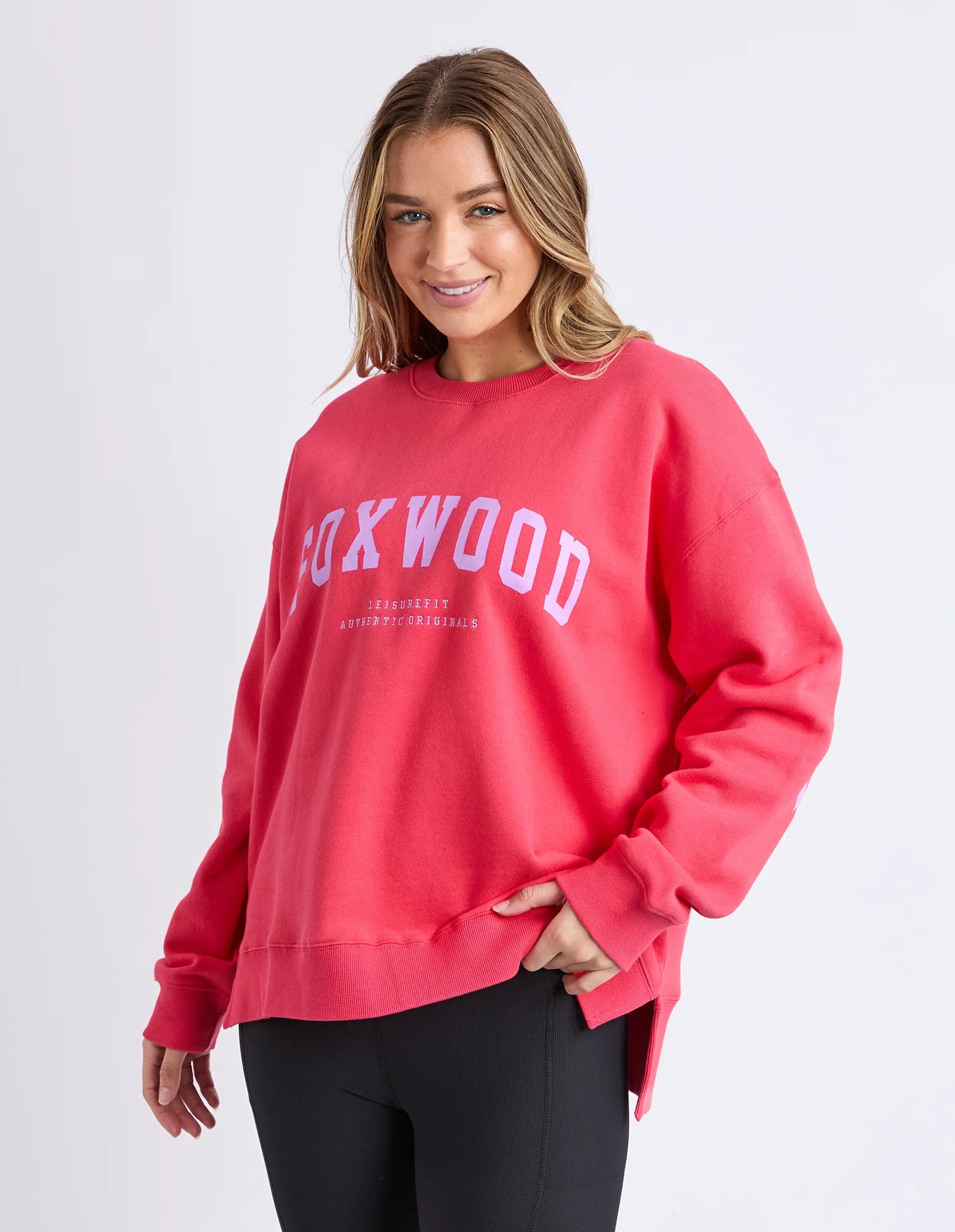 Foxwood Interval Crew in Raspberry and Neon Lilac, featuring a colorful knitted pattern and ribbed cuffs.