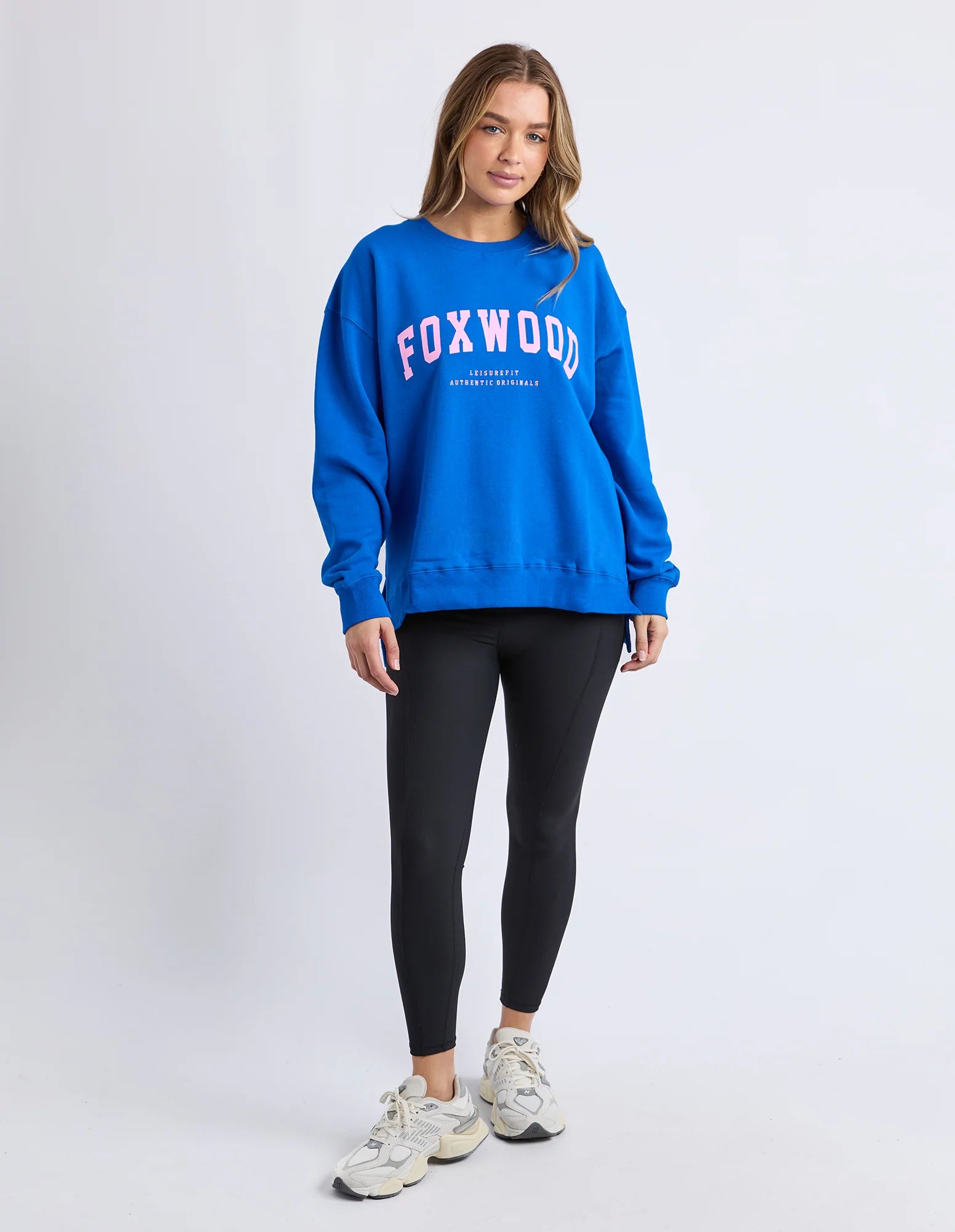 Foxwood Interval Crew in cobalt and neon pink, featuring a close-up of the colorful knit fabric and detailed stitching.